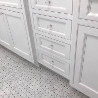 custom bathroom tile floor and cabinet hardware
